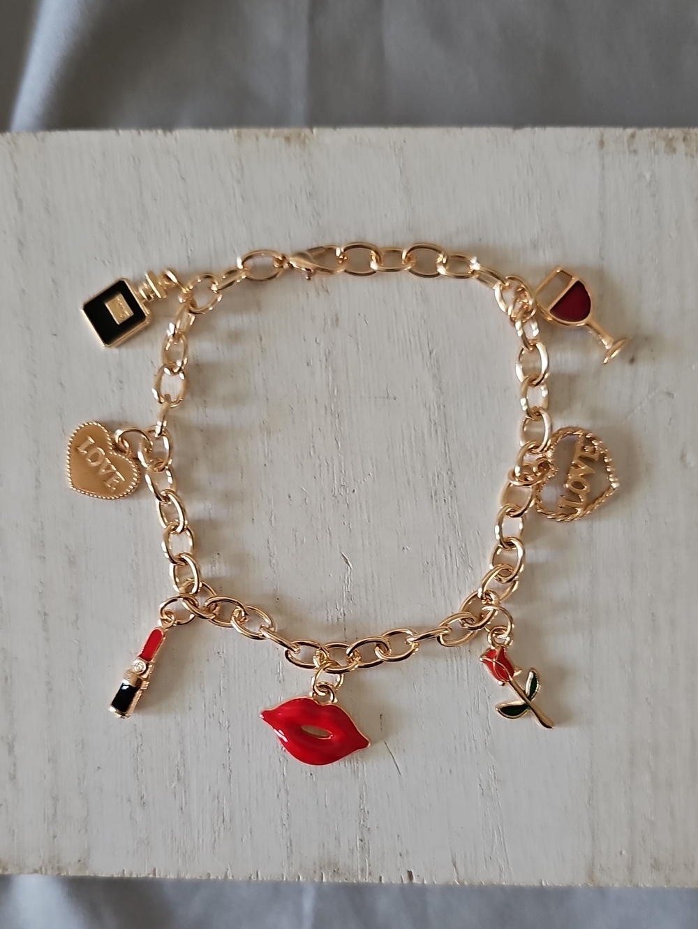 Gold-Tone Charm Bracelet with Red Enamel Accents